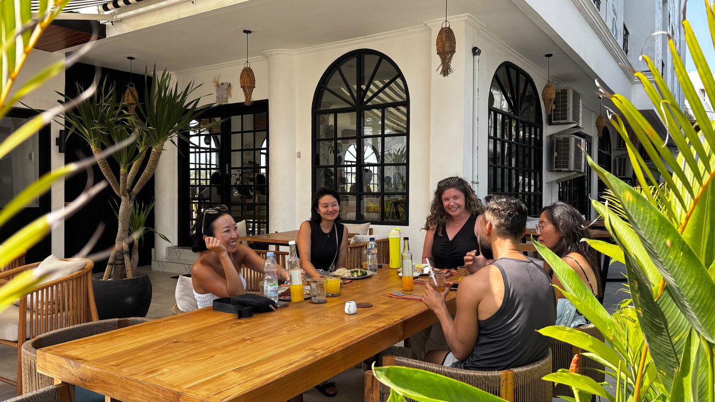 A small group sharing a meal together in Bali